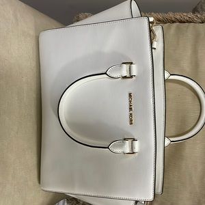 Michael Kors white handbag.
